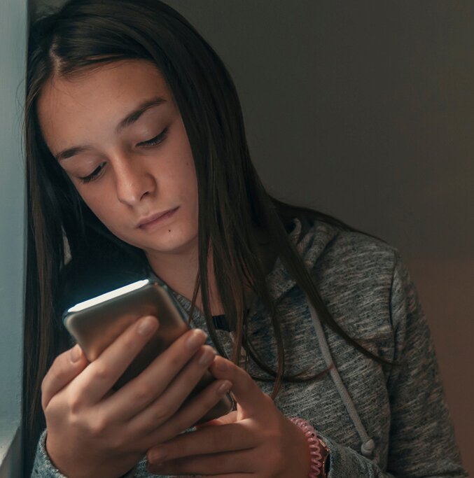 social-media-insights-girl-looking-at-phone
